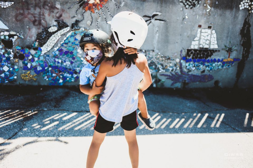 Kids in bike helmets and masks